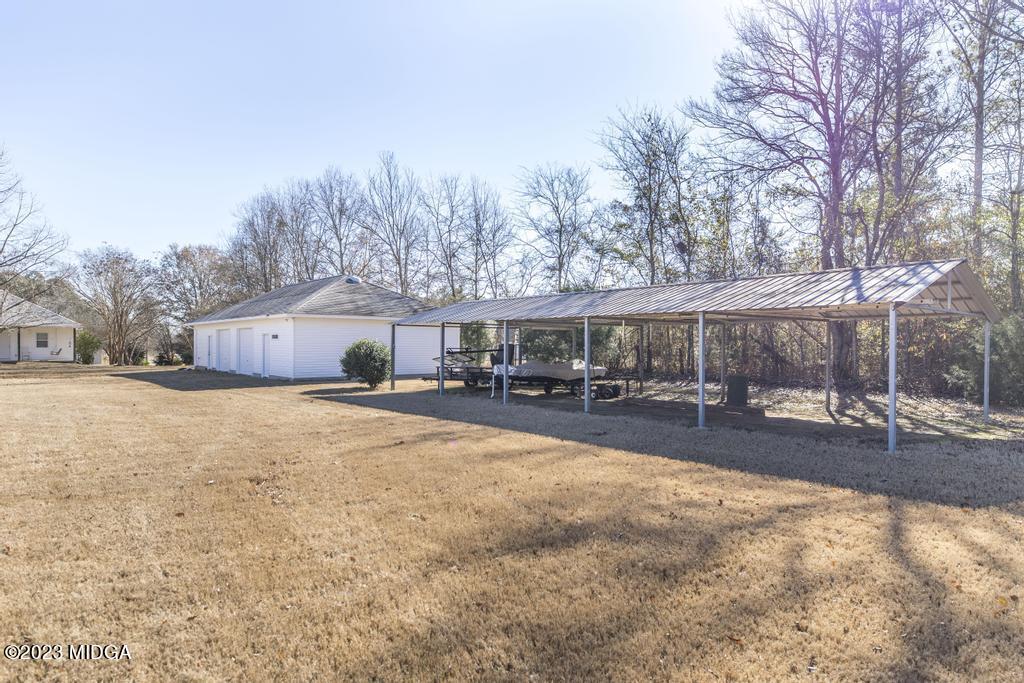 6375 Barfield Road Macon, GA 31216 - Photo 14 of 60 a view of a house with snow on the road