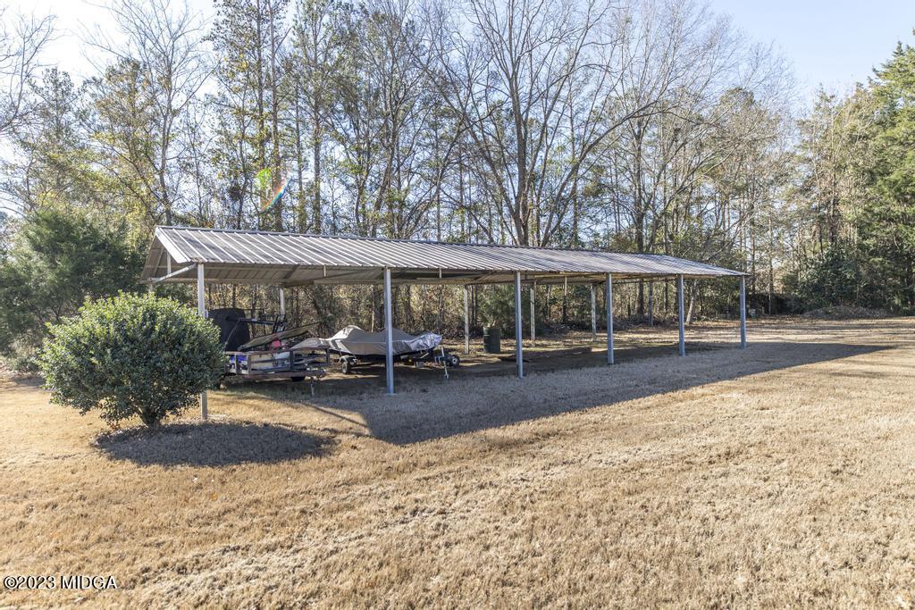 6375 Barfield Road Macon, GA 31216 - Photo 15 of 60 a view of a house with swimming pool and sitting area