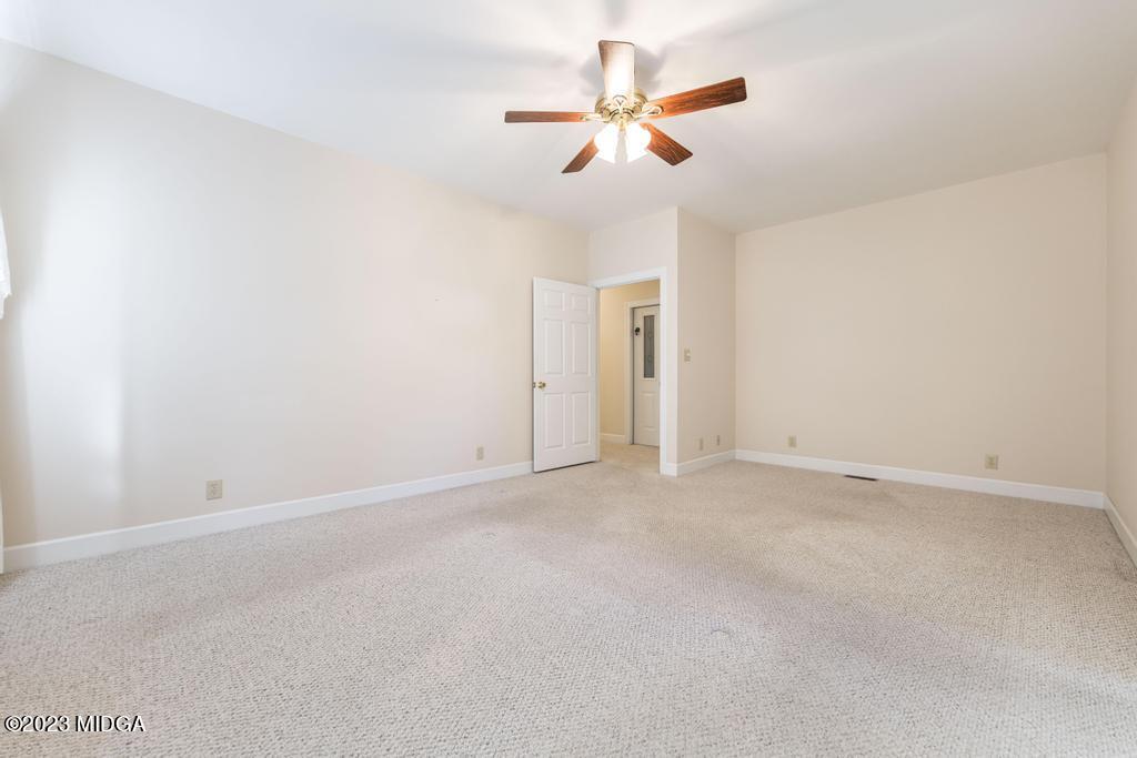 6375 Barfield Road Macon, GA 31216 - Photo 24 of 60 an empty room with closet and a ceiling fan