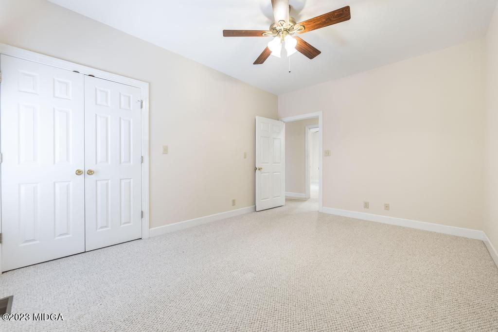 6375 Barfield Road Macon, GA 31216 - Photo 35 of 60 an empty room with windows and fan