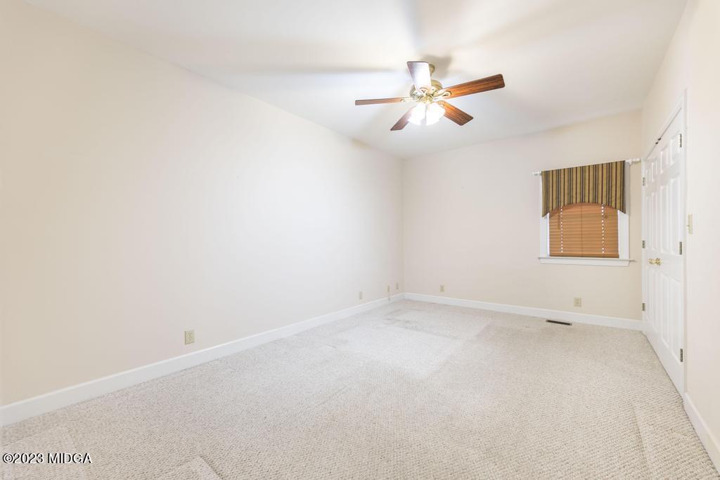 6375 Barfield Road Macon, GA 31216 - Photo 36 of 60 an empty room with windows and fan