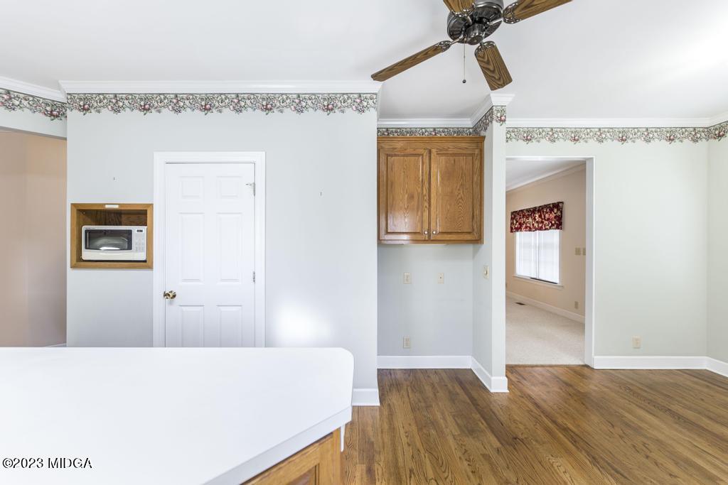6375 Barfield Road Macon, GA 31216 - Photo 41 of 60 a bedroom with a bed and a chandelier