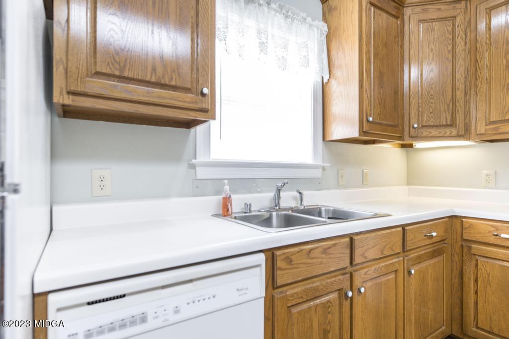 6375 Barfield Road Macon, GA 31216 - Photo 43 of 60 a kitchen with a sink and cabinets