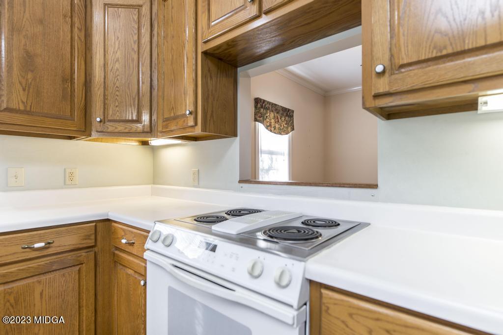 6375 Barfield Road Macon, GA 31216 - Photo 44 of 60 a kitchen with granite countertop cabinets stainless steel appliances and a counter space