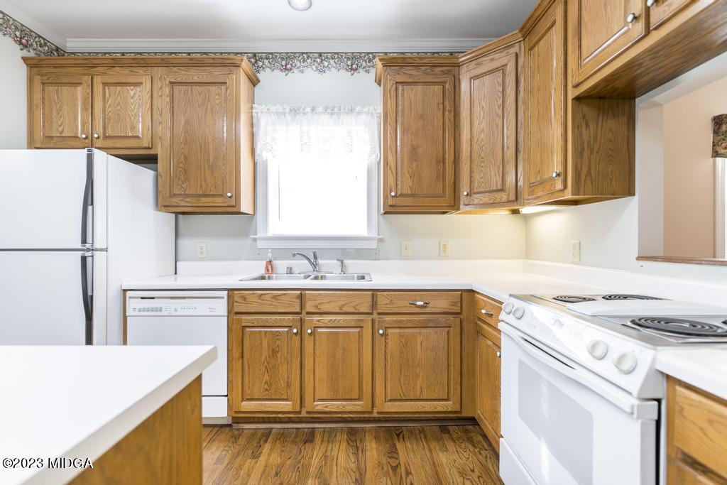 6375 Barfield Road Macon, GA 31216 - Photo 45 of 60 a kitchen with a stove a sink and a refrigerator