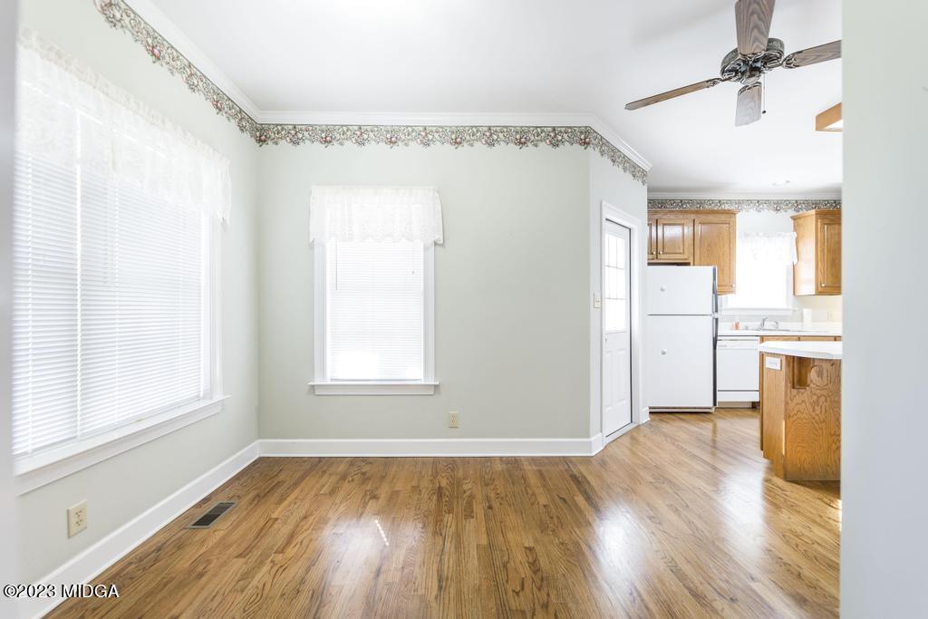 6375 Barfield Road Macon, GA 31216 - Photo 56 of 60 a view of an empty room with a window and wooden floor