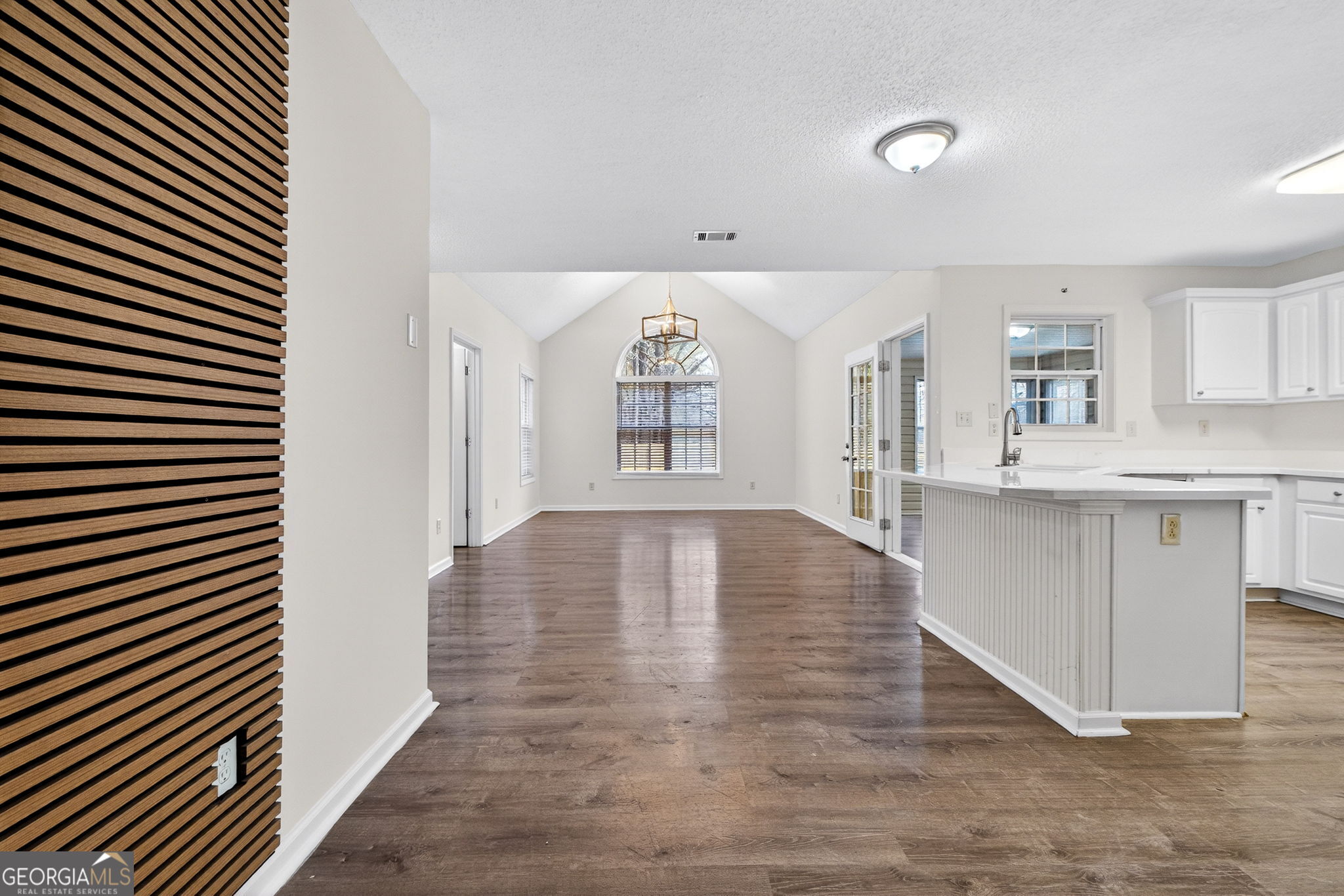 108 Whippoorwill Ridge Road Jackson, GA 30233 - Photo 11 of 39 an empty room with wooden floor and windows