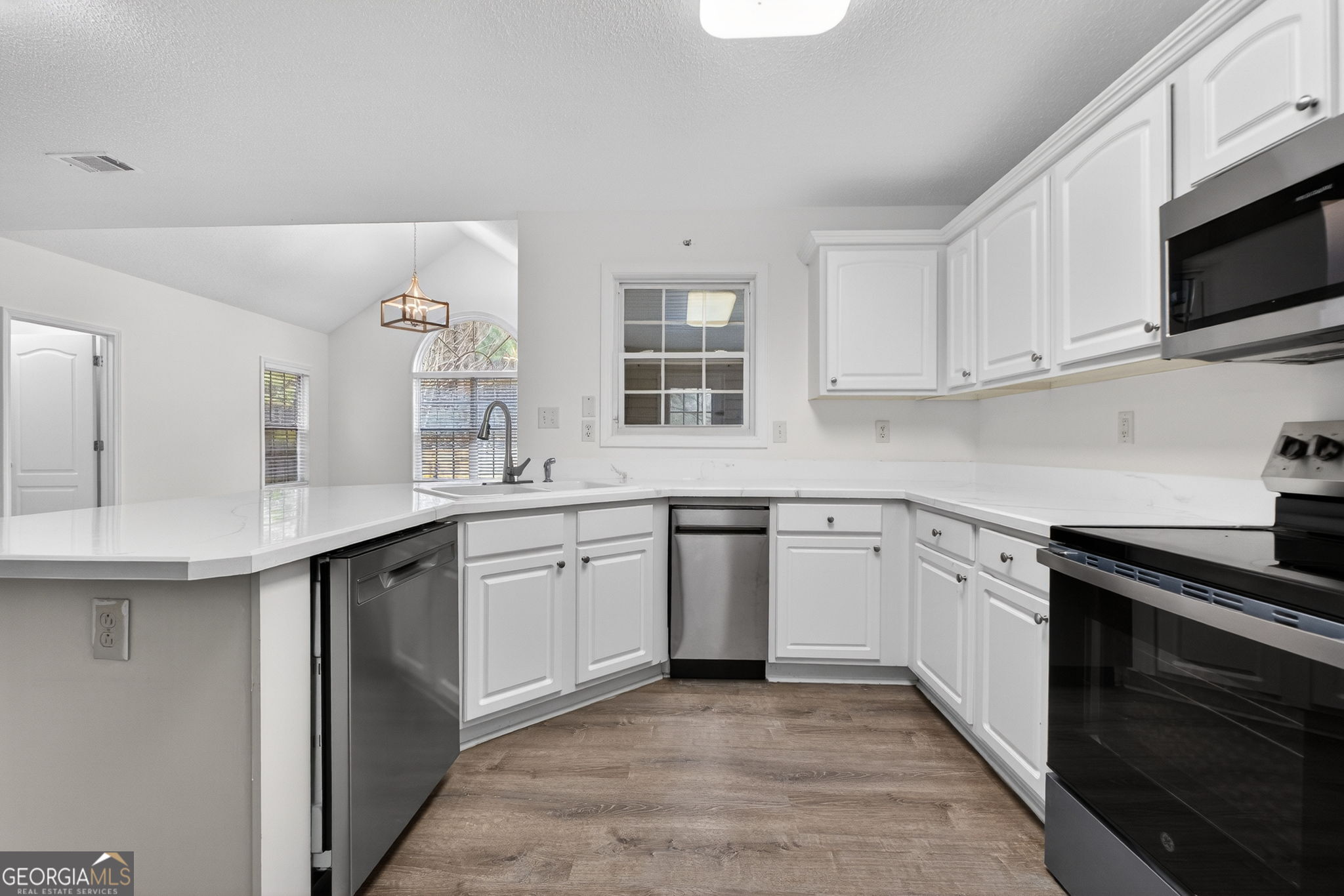108 Whippoorwill Ridge Road Jackson, GA 30233 - Photo 14 of 39 a kitchen with granite countertop cabinets stainless steel appliances and a sink