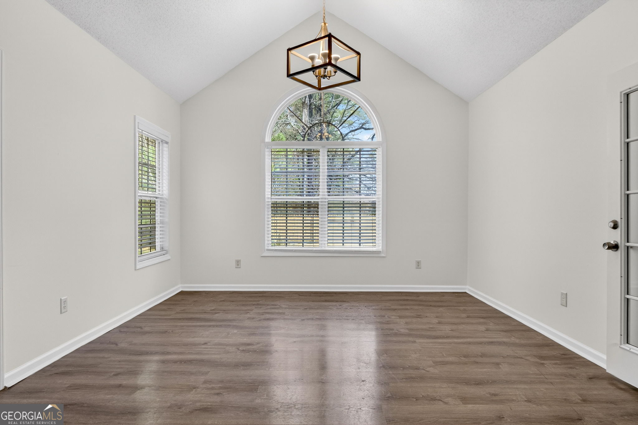 108 Whippoorwill Ridge Road Jackson, GA 30233 - Photo 15 of 39 wooden floor in an empty room with a window