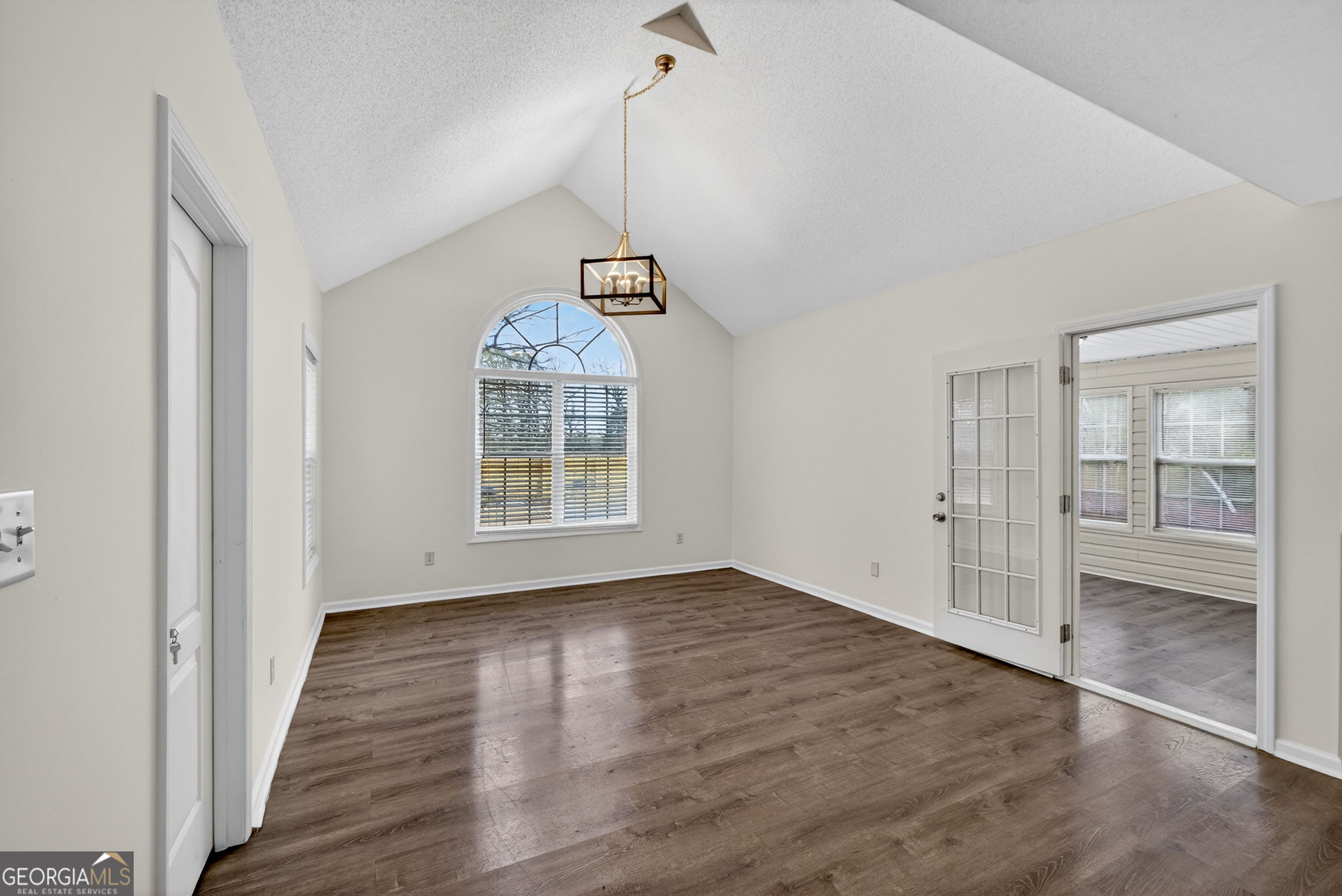108 Whippoorwill Ridge Road Jackson, GA 30233 - Photo 16 of 39 a view of an empty room with wooden floor and a window