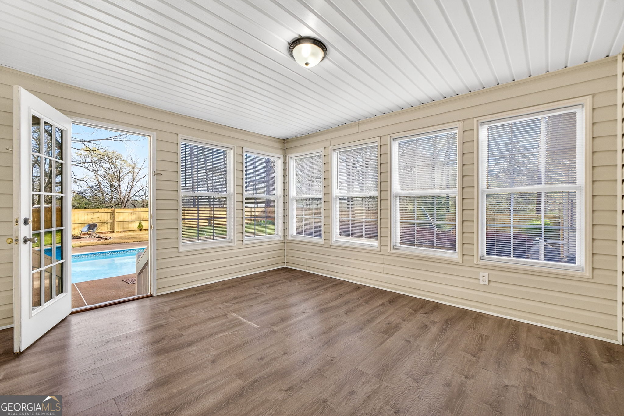 108 Whippoorwill Ridge Road Jackson, GA 30233 - Photo 17 of 39 an empty room with wooden floor and windows