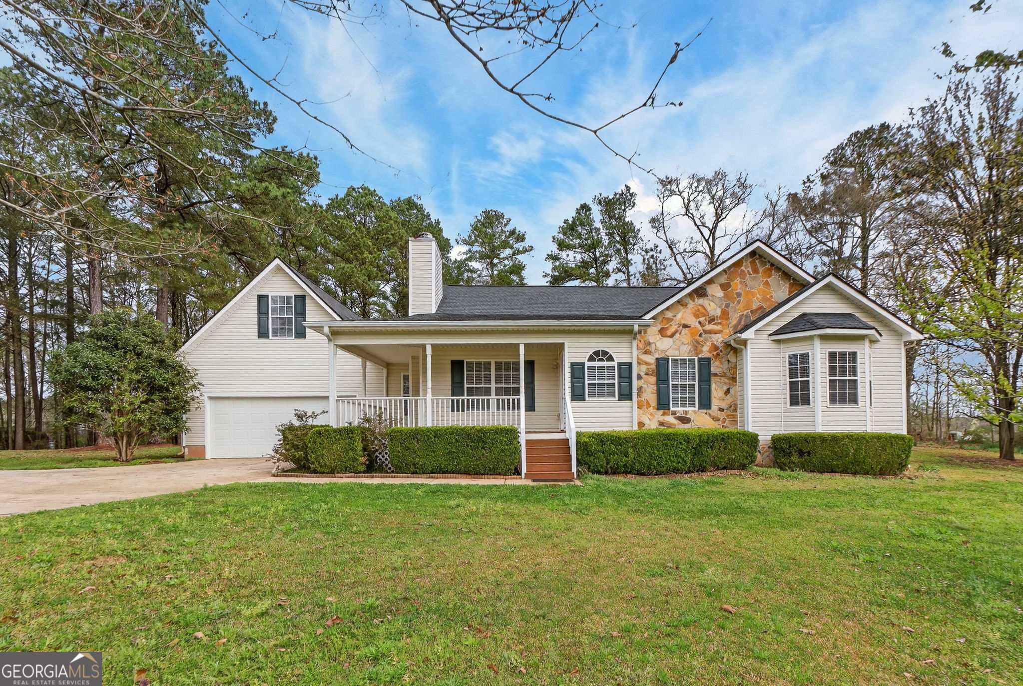 108 Whippoorwill Ridge Road Jackson, GA 30233 - Photo 2 of 39 a front view of house with yard and green space