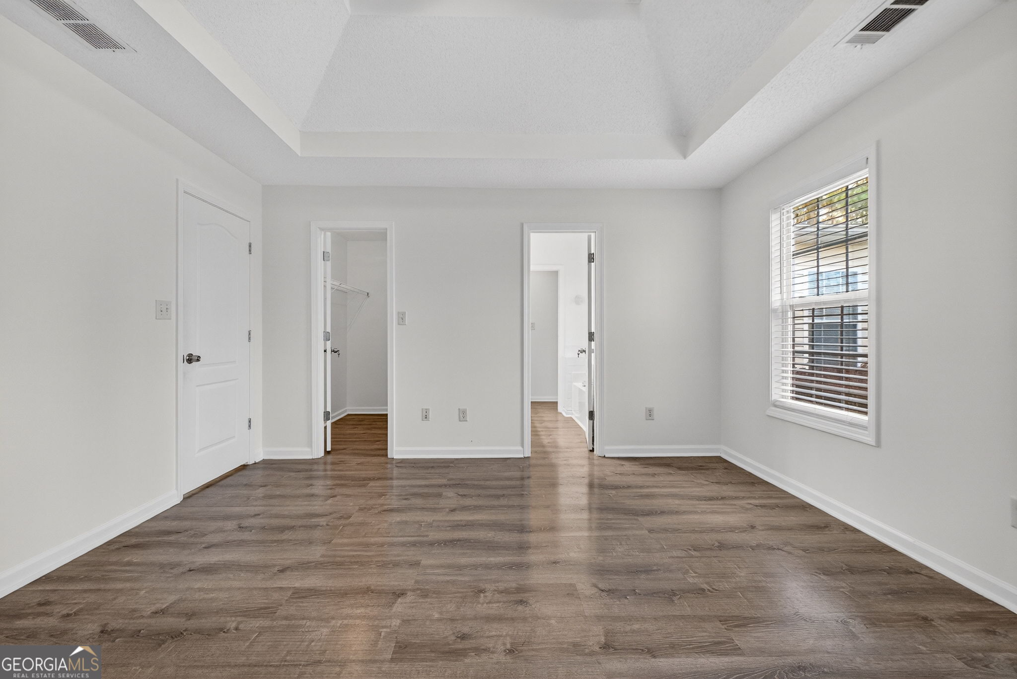 108 Whippoorwill Ridge Road Jackson, GA 30233 - Photo 21 of 39 a view of an empty room with wooden floor and a window