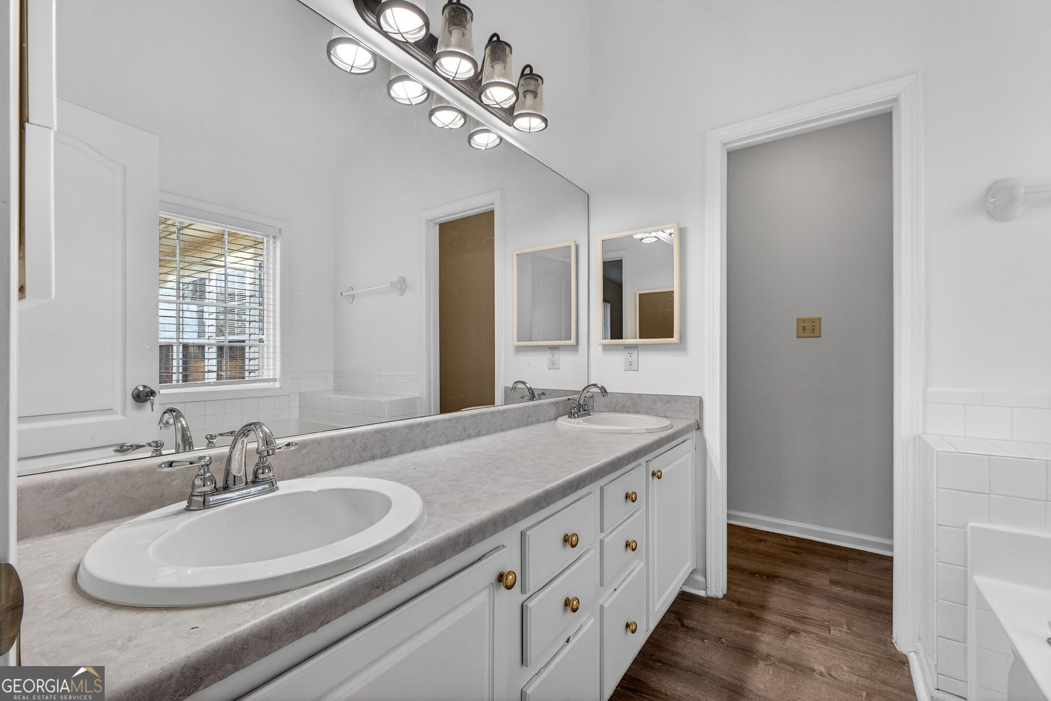 108 Whippoorwill Ridge Road Jackson, GA 30233 - Photo 22 of 39 a bathroom with a double vanity sink a mirror and a shower