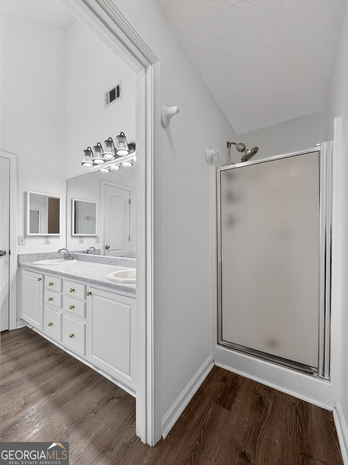 108 Whippoorwill Ridge Road Jackson, GA 30233 - Photo 24 of 39 a bathroom with a double vanity sink mirror and shower