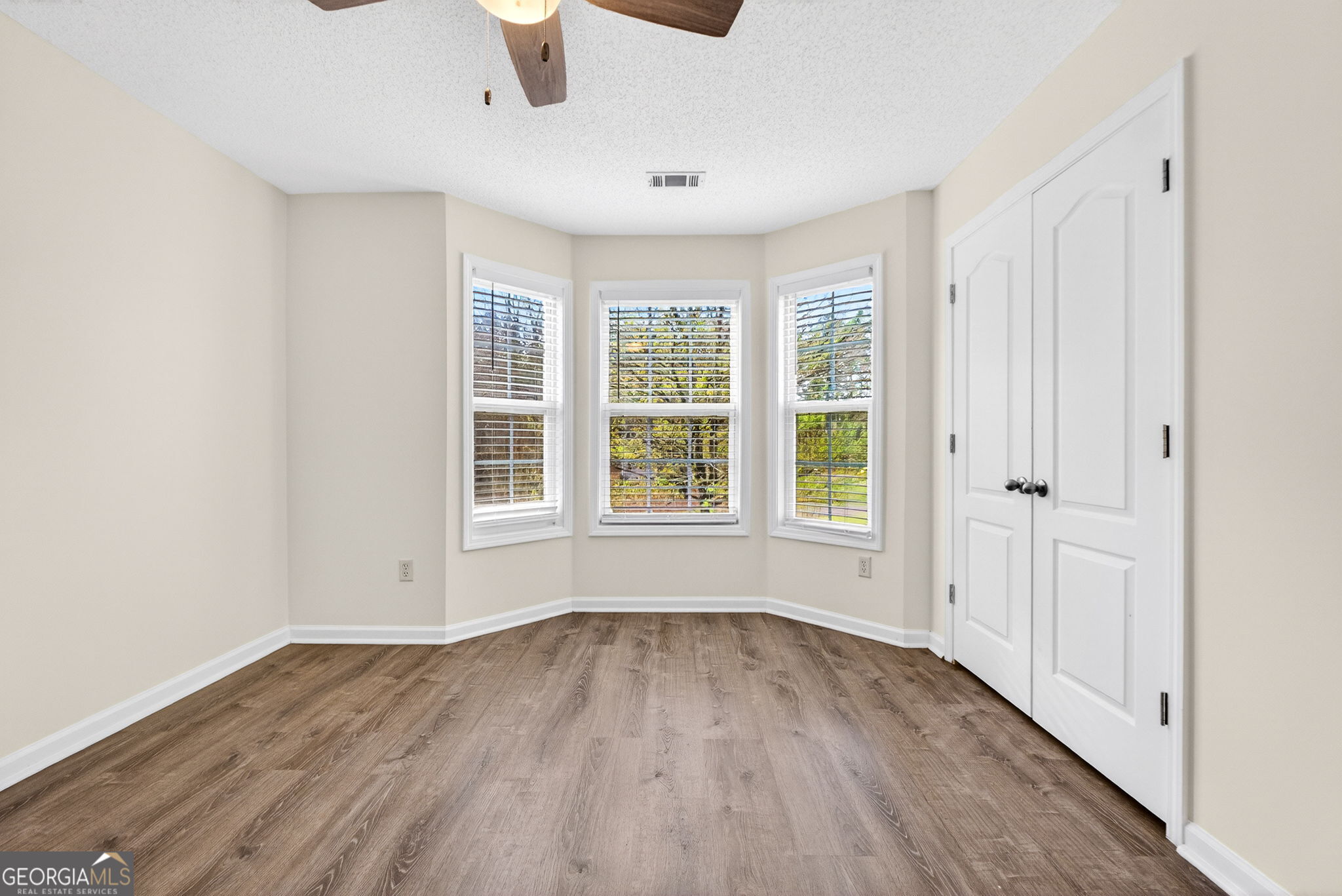 108 Whippoorwill Ridge Road Jackson, GA 30233 - Photo 26 of 39 an empty room with wooden floor and windows