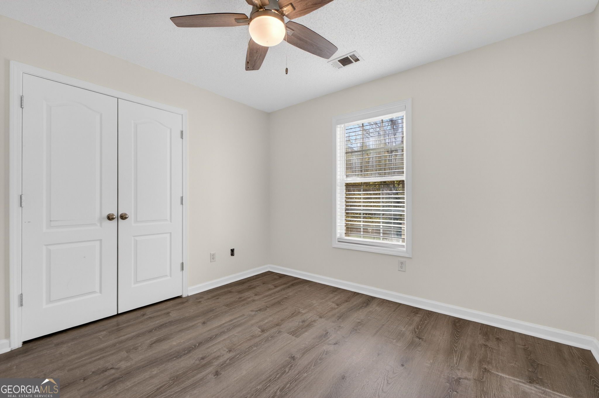 108 Whippoorwill Ridge Road Jackson, GA 30233 - Photo 31 of 39 a view of an empty room with wooden floor and a window