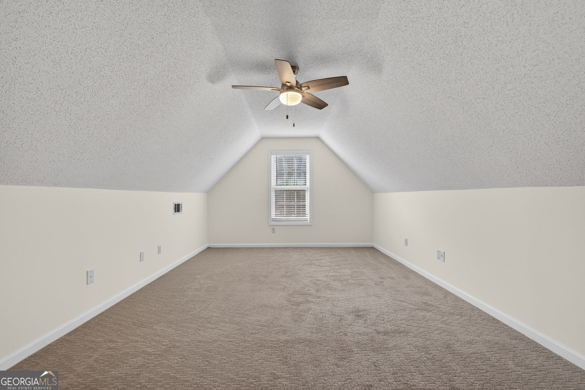 108 Whippoorwill Ridge Road Jackson, GA 30233 - Photo 33 of 39 an empty room with a window and a ceiling fan