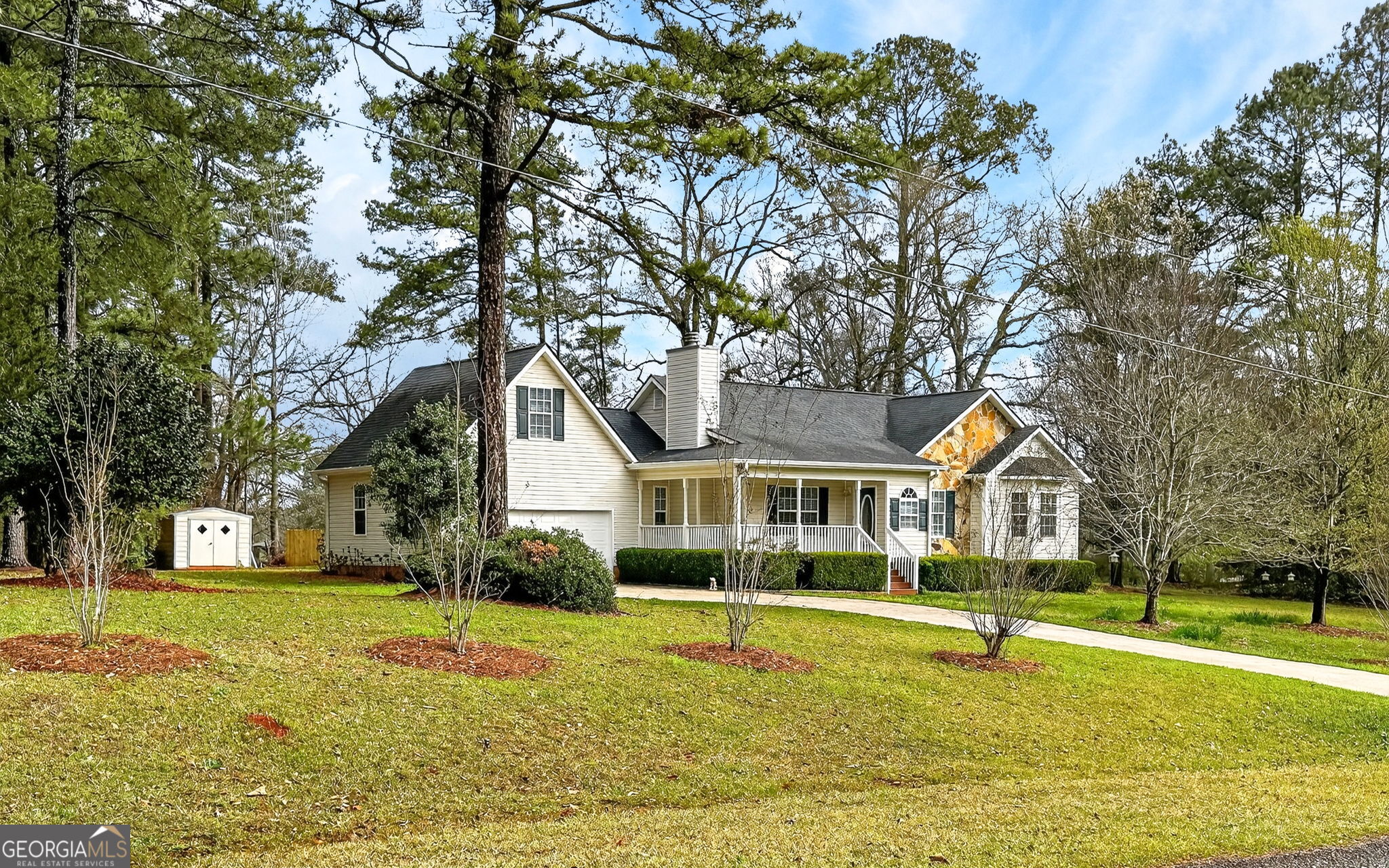 108 Whippoorwill Ridge Road Jackson, GA 30233 - Photo 5 of 39 a house that has a tree in front of it