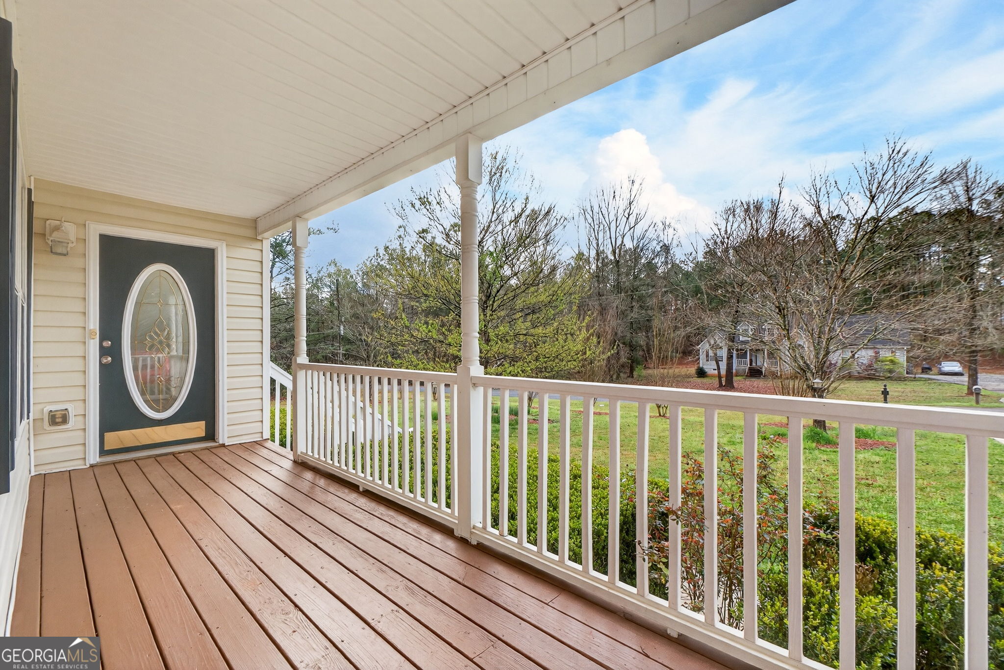 108 Whippoorwill Ridge Road Jackson, GA 30233 - Photo 7 of 39 a view of a balcony with wooden floor and fence