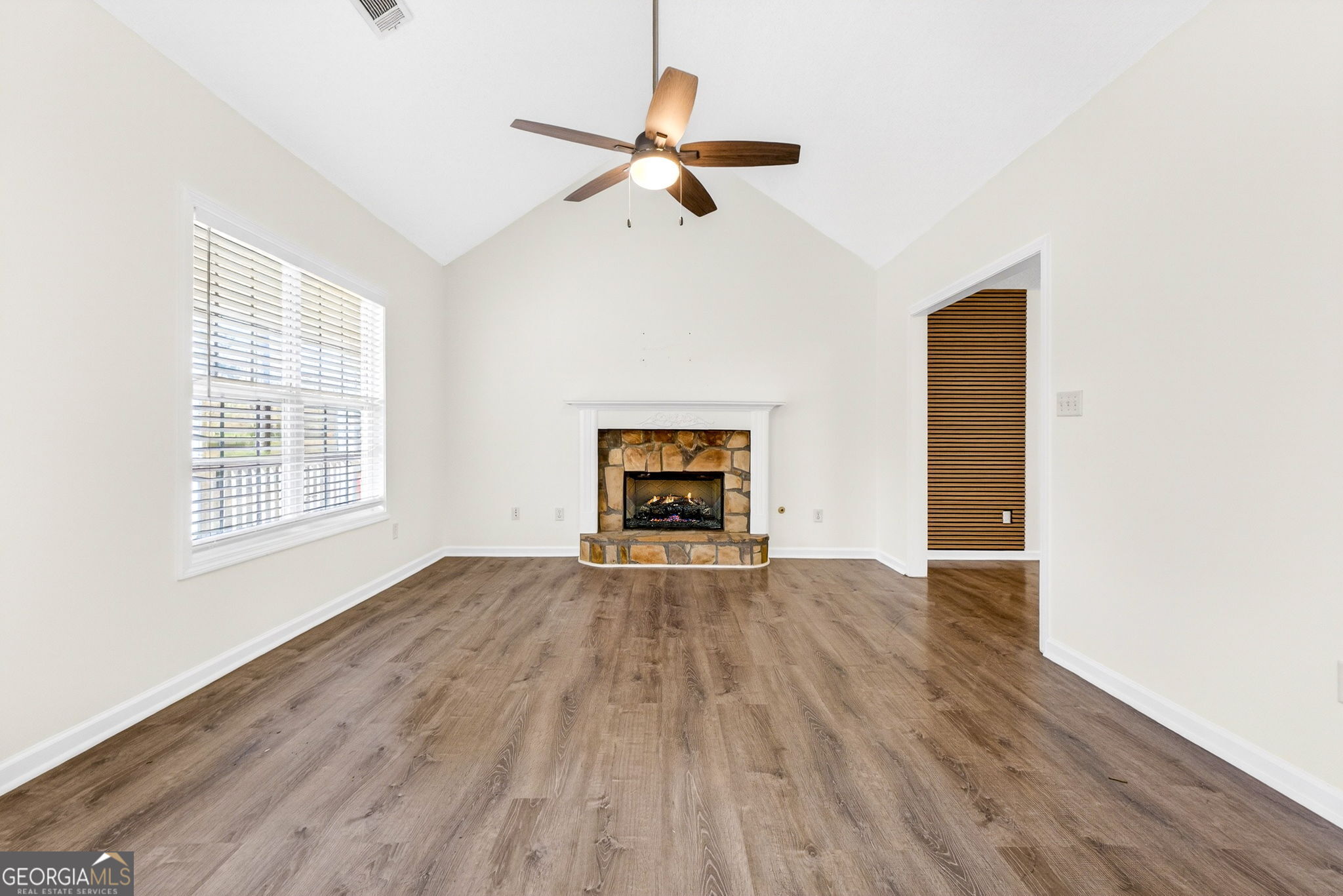 108 Whippoorwill Ridge Road Jackson, GA 30233 - Photo 9 of 39 a view of empty room with wooden floor and fan