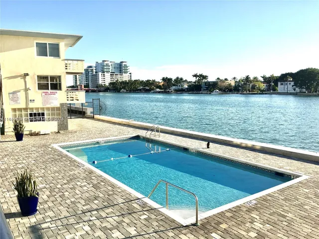 a view of swimming pool with a lake view