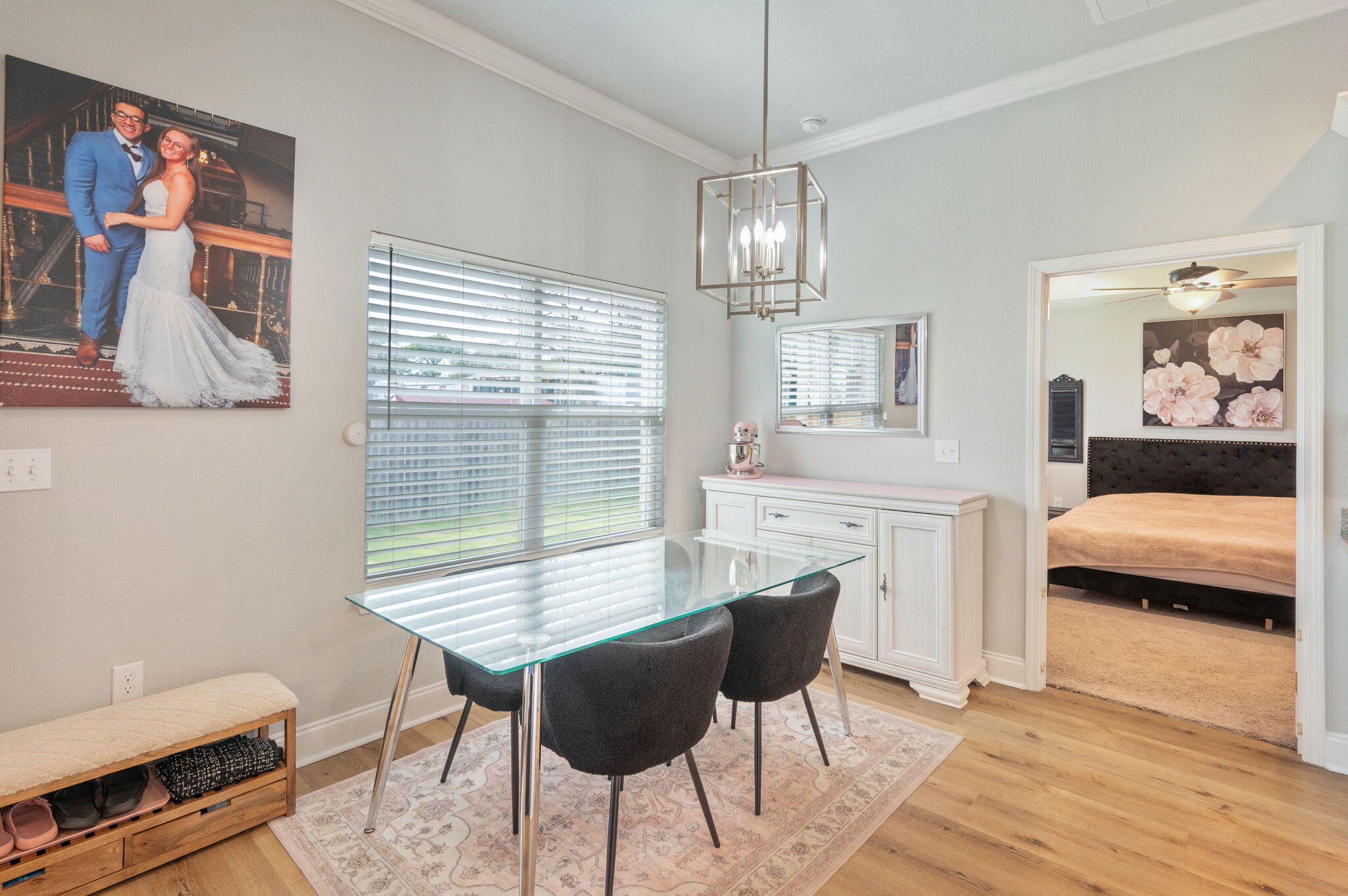 899 Al Hammett Road Mary Esther, FL 32569 - Photo 13 of 34 a view of a dining room with furniture window and wooden floor