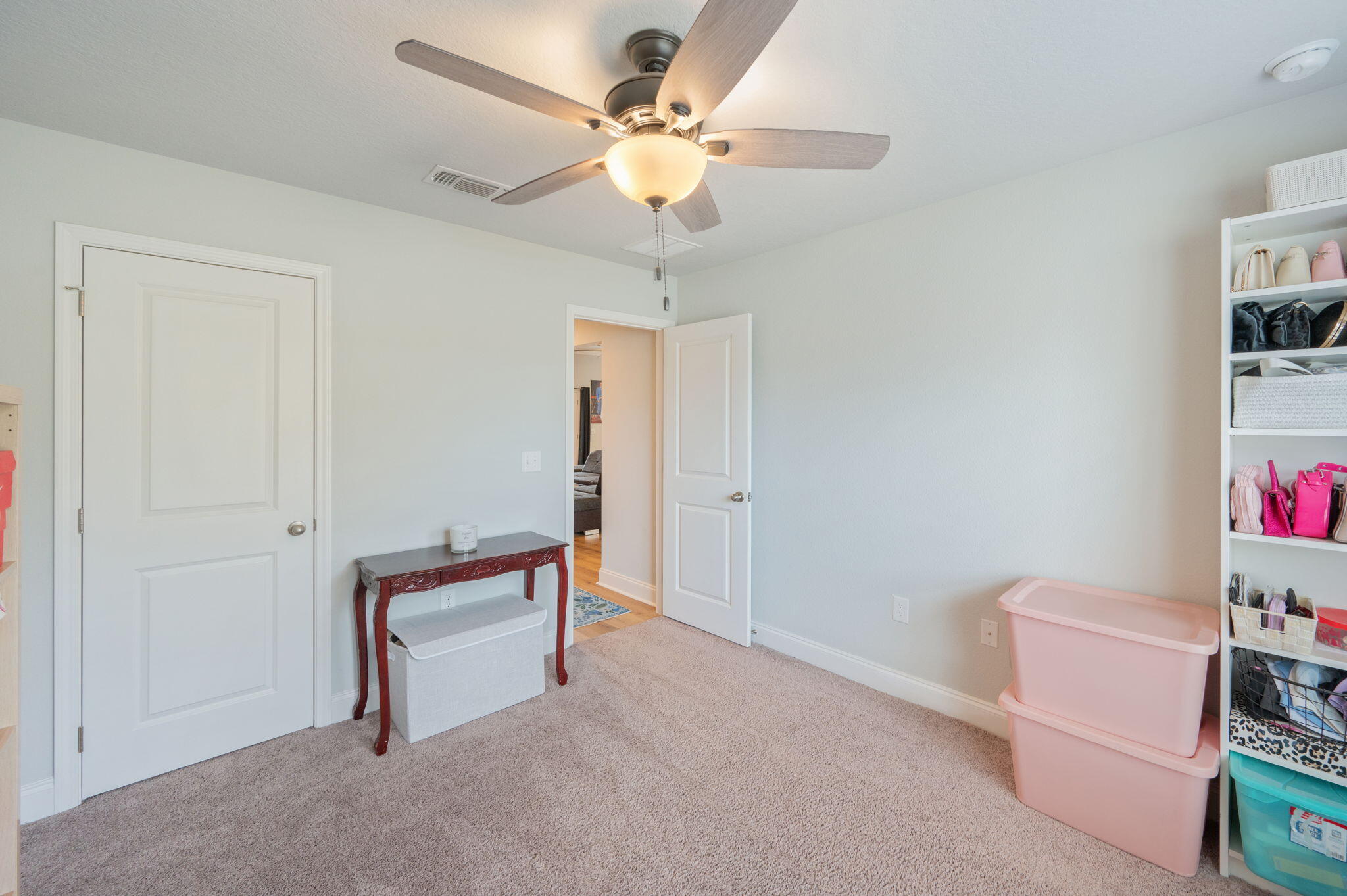 899 Al Hammett Road Mary Esther, FL 32569 - Photo 15 of 34 wooden floor in a room with a bench