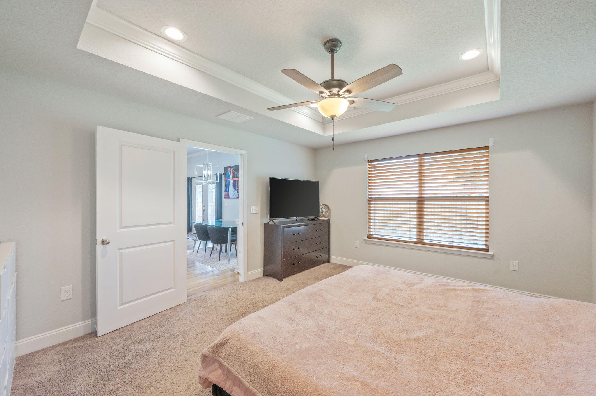 899 Al Hammett Road Mary Esther, FL 32569 - Photo 24 of 34 a spacious bedroom with a large bed and a flat screen tv