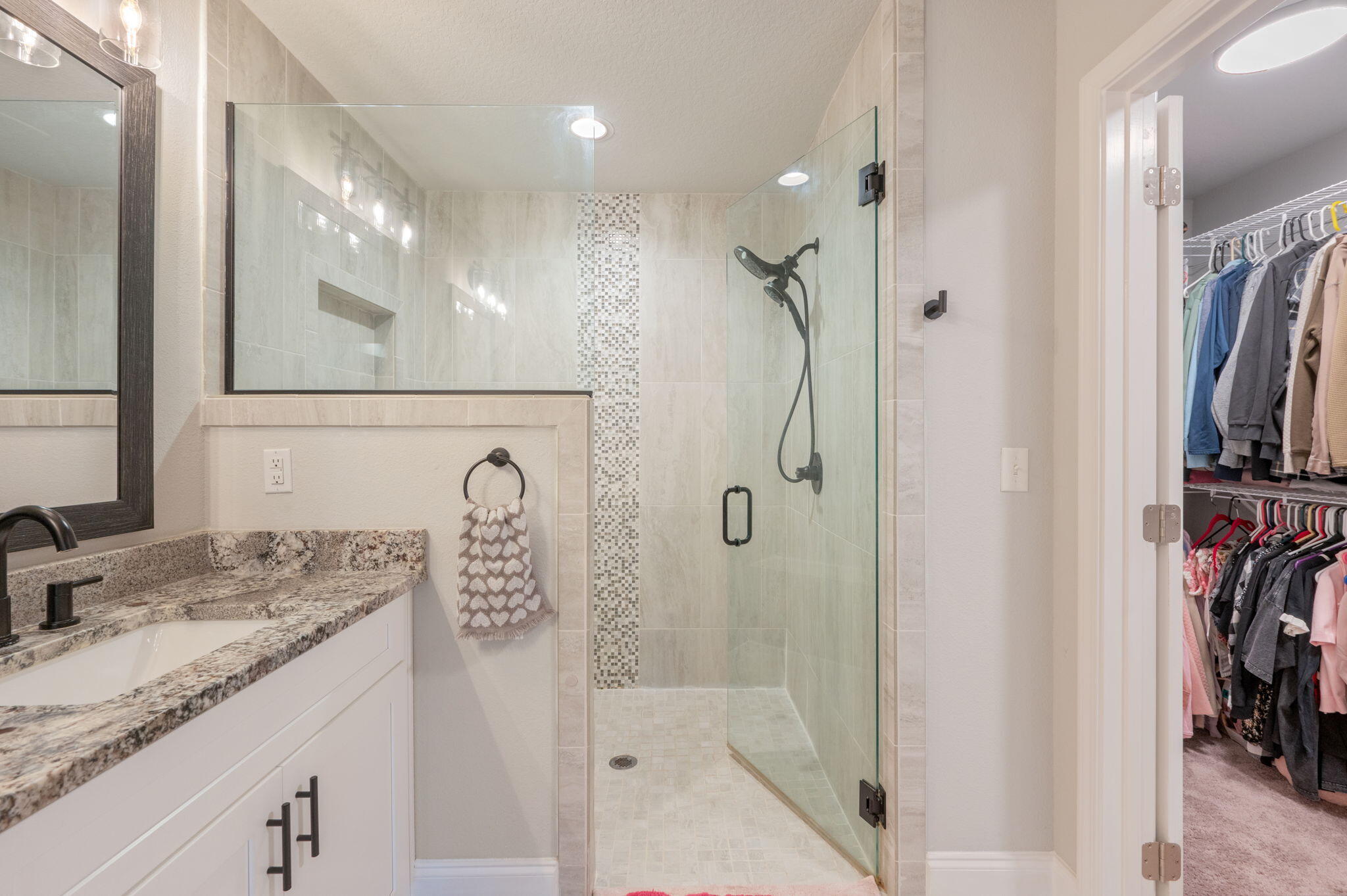 899 Al Hammett Road Mary Esther, FL 32569 - Photo 28 of 34 a bathroom with a granite countertop sink a mirror and a shower