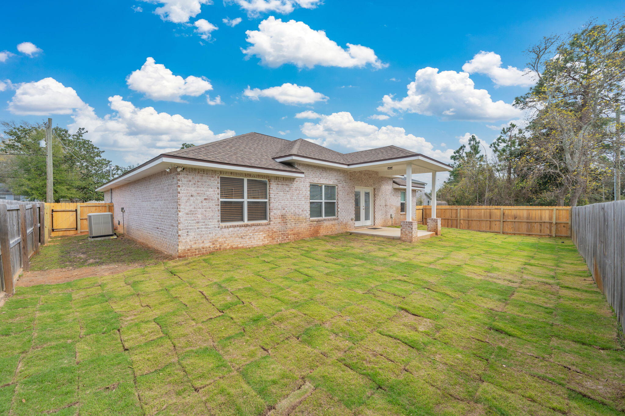 899 Al Hammett Road Mary Esther, FL 32569 - Photo 33 of 34 a view of a house with a backyard