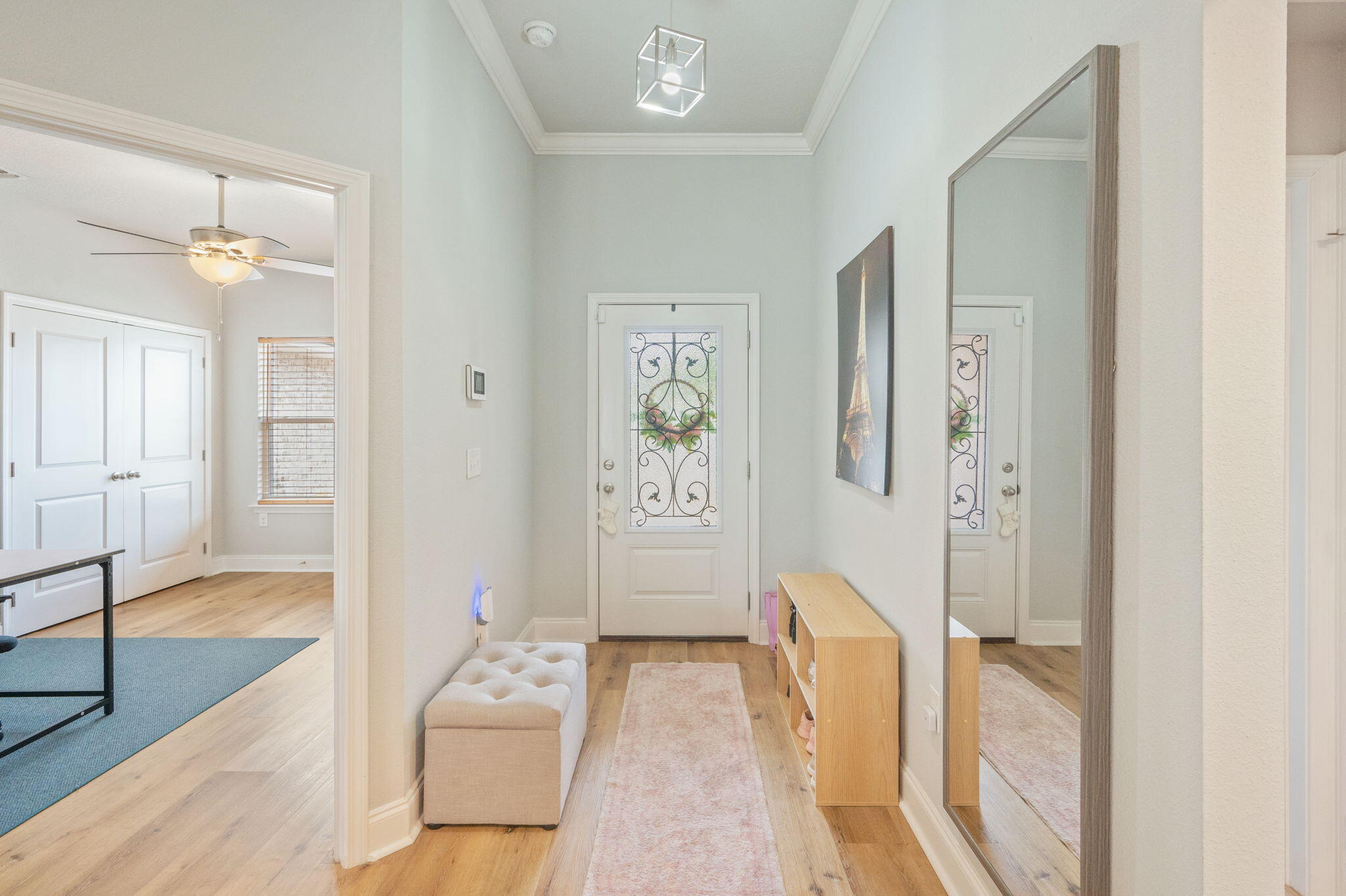 899 Al Hammett Road Mary Esther, FL 32569 - Photo 5 of 34 a hallway with white doors wooden floor and front door
