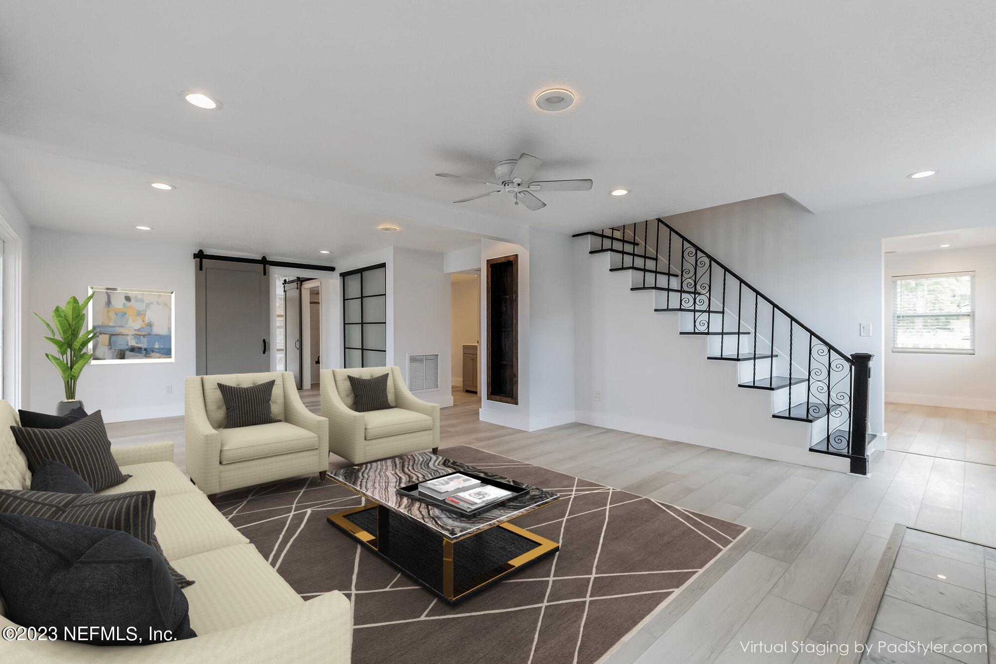 3307 Trout River Boulevard Jacksonville, FL 32208 - Photo 12 of 37 a living room with furniture and wooden floor