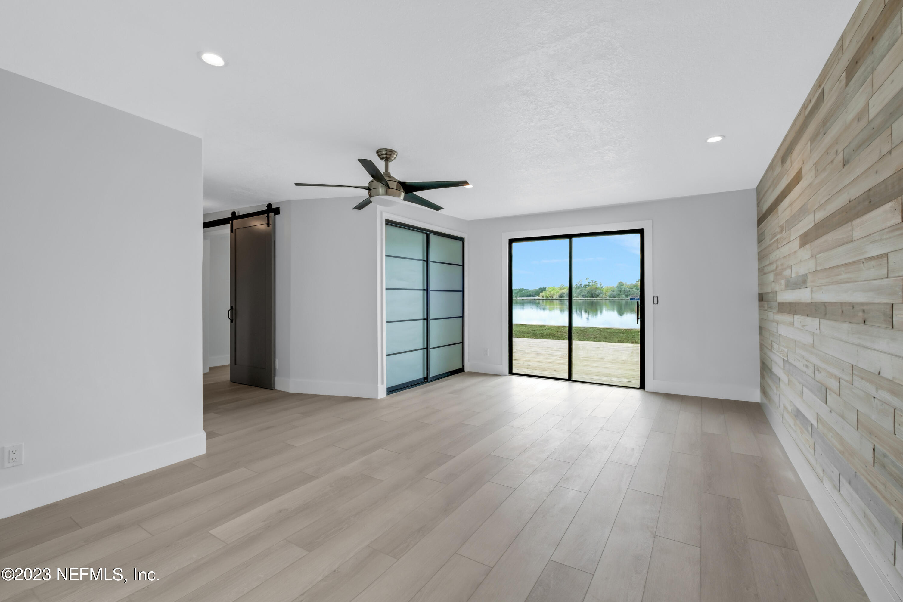 3307 Trout River Boulevard Jacksonville, FL 32208 - Photo 20 of 37 a view of empty room with wooden floor and fan