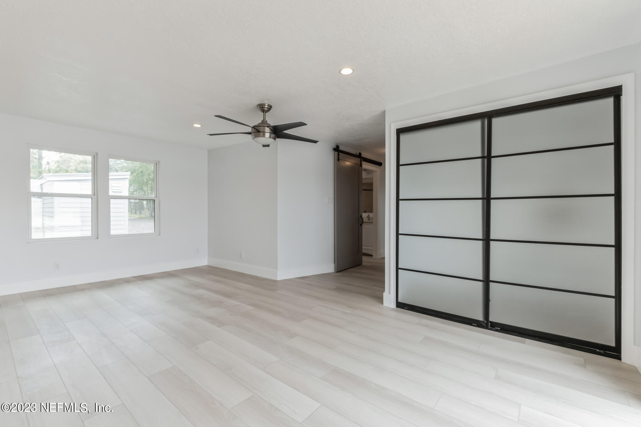 3307 Trout River Boulevard Jacksonville, FL 32208 - Photo 21 of 37 wooden floor in an empty room with a window