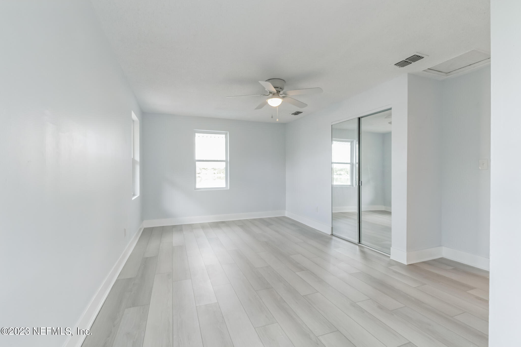 3307 Trout River Boulevard Jacksonville, FL 32208 - Photo 25 of 37 an empty room with wooden floor and window