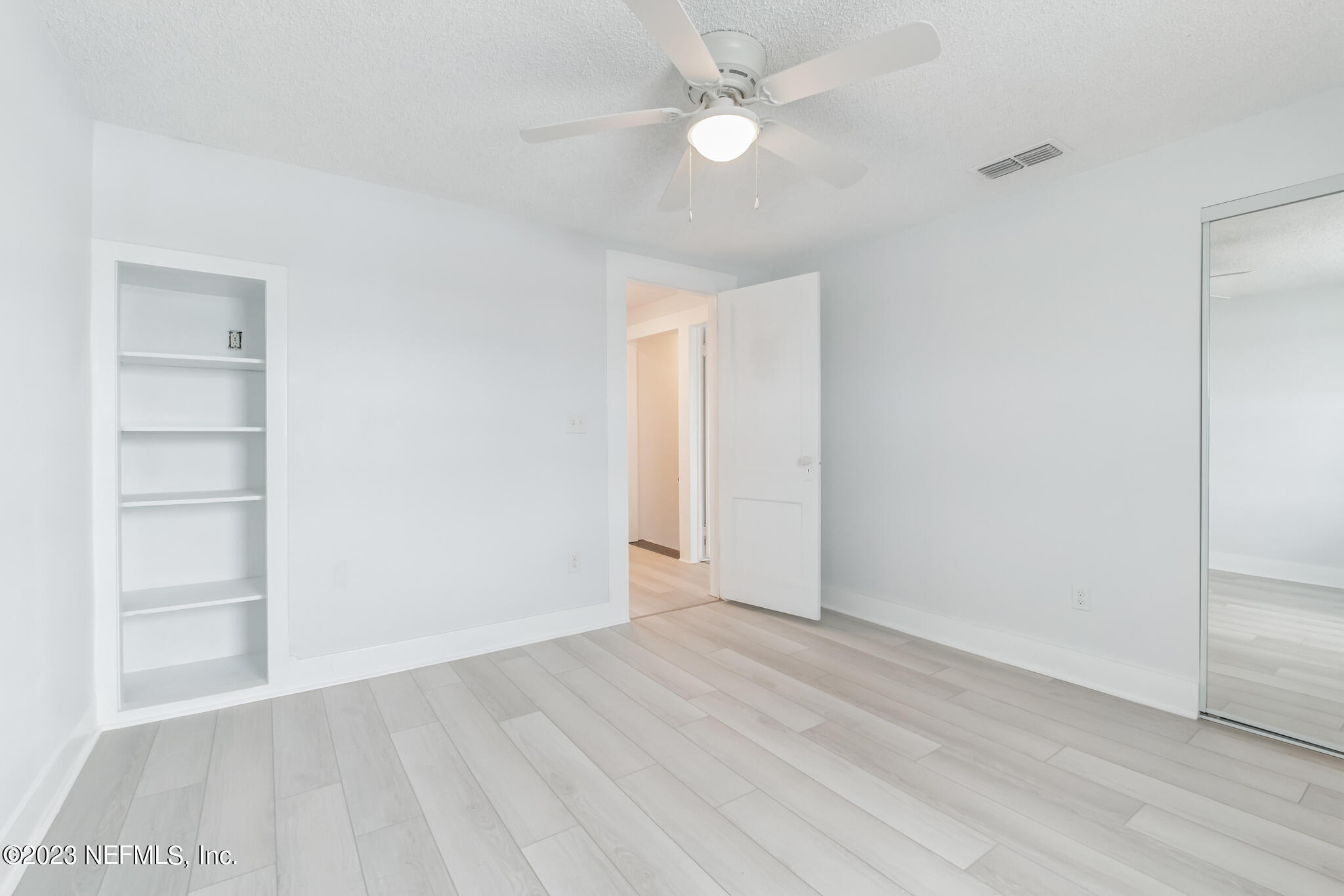 3307 Trout River Boulevard Jacksonville, FL 32208 - Photo 26 of 37 wooden floor in an empty room