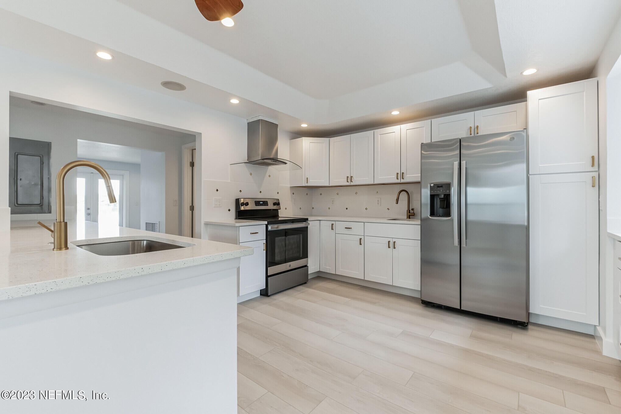 3307 Trout River Boulevard Jacksonville, FL 32208 - Photo 5 of 37 a kitchen with stainless steel appliances granite countertop a refrigerator sink and cabinets