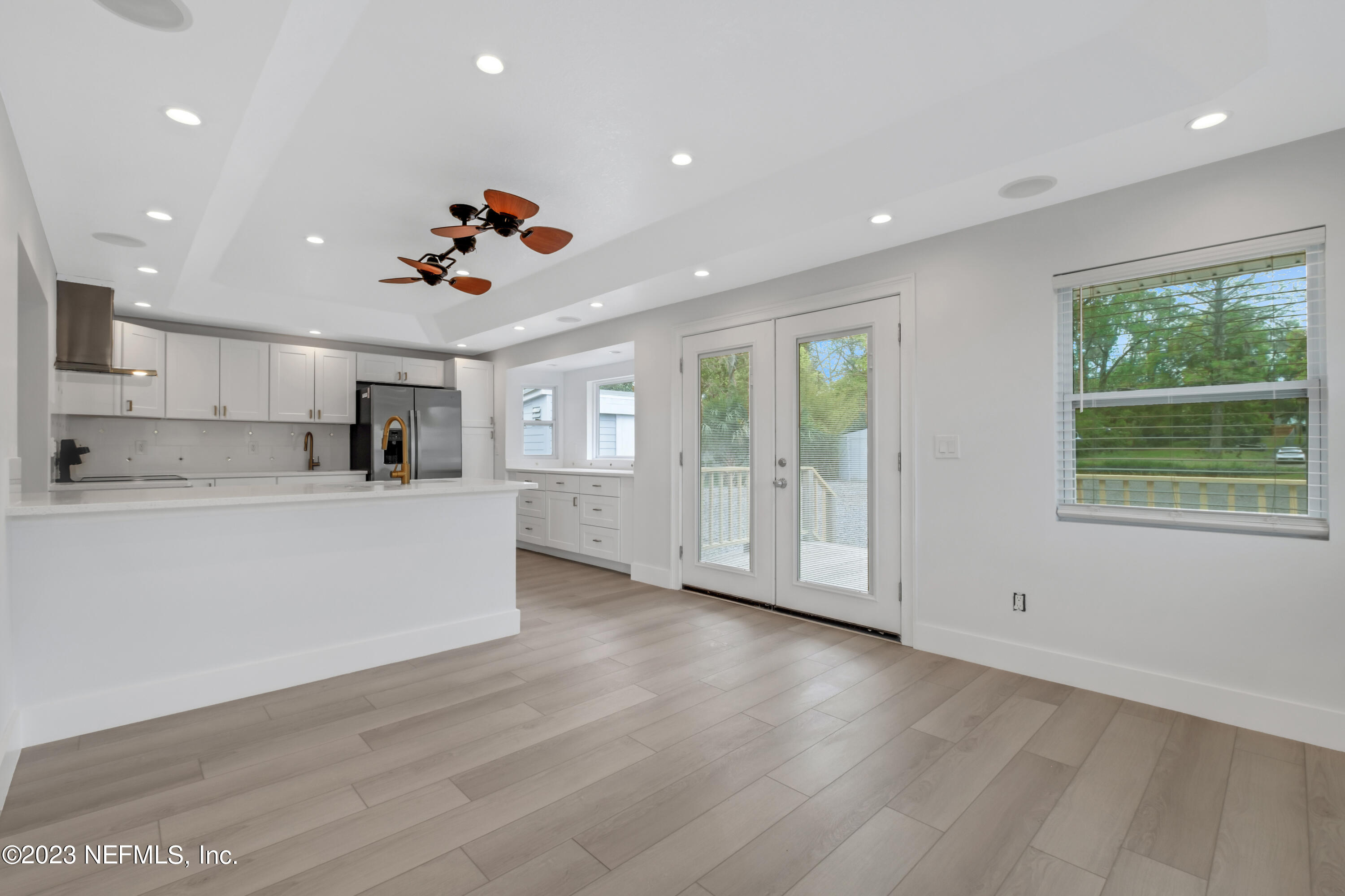 3307 Trout River Boulevard Jacksonville, FL 32208 - Photo 7 of 37 a view of kitchen with furniture large window and wooden floor