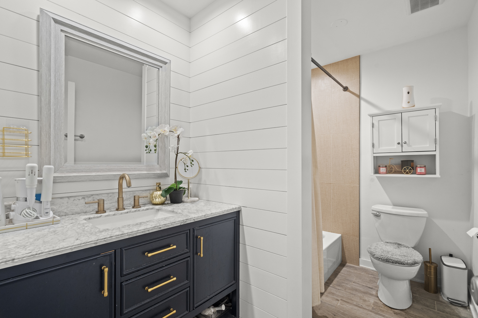 9-s220 S Frontage Road, Unit 210 Darien, IL 60527 - Photo 8 of 14 a bathroom with a granite countertop sink toilet and mirror