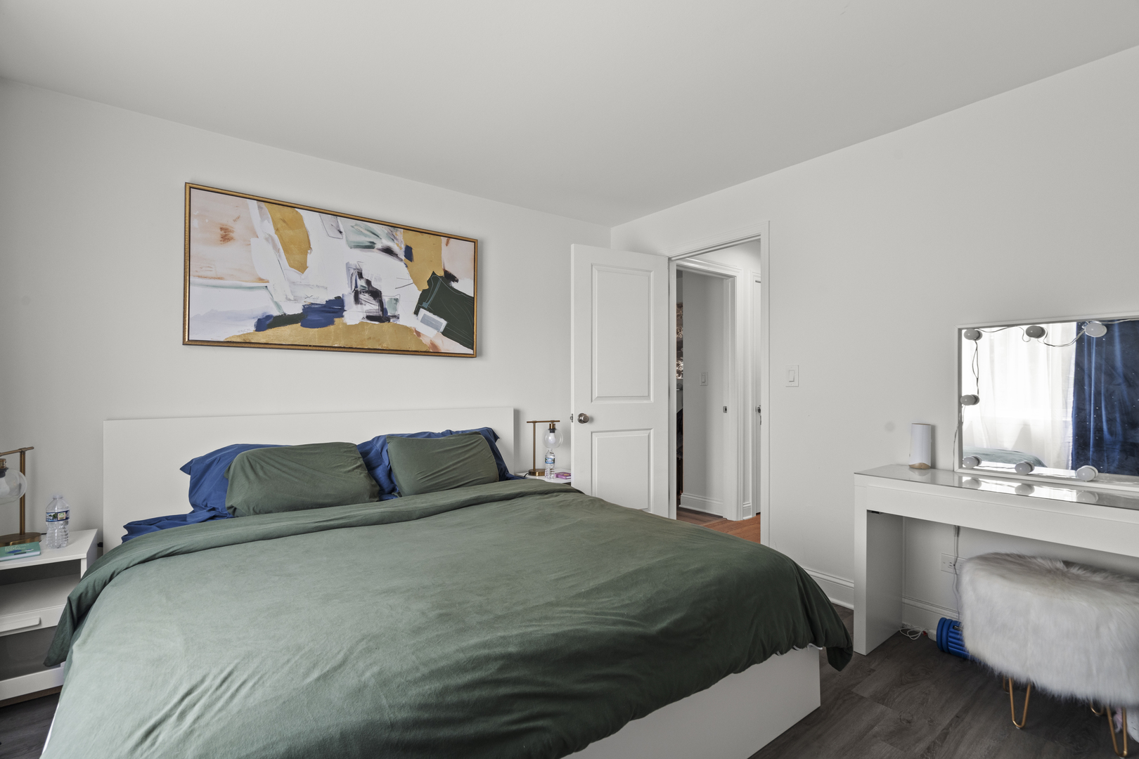 9-s220 S Frontage Road, Unit 210 Darien, IL 60527 - Photo 10 of 14 a bedroom with a bed and a chandelier