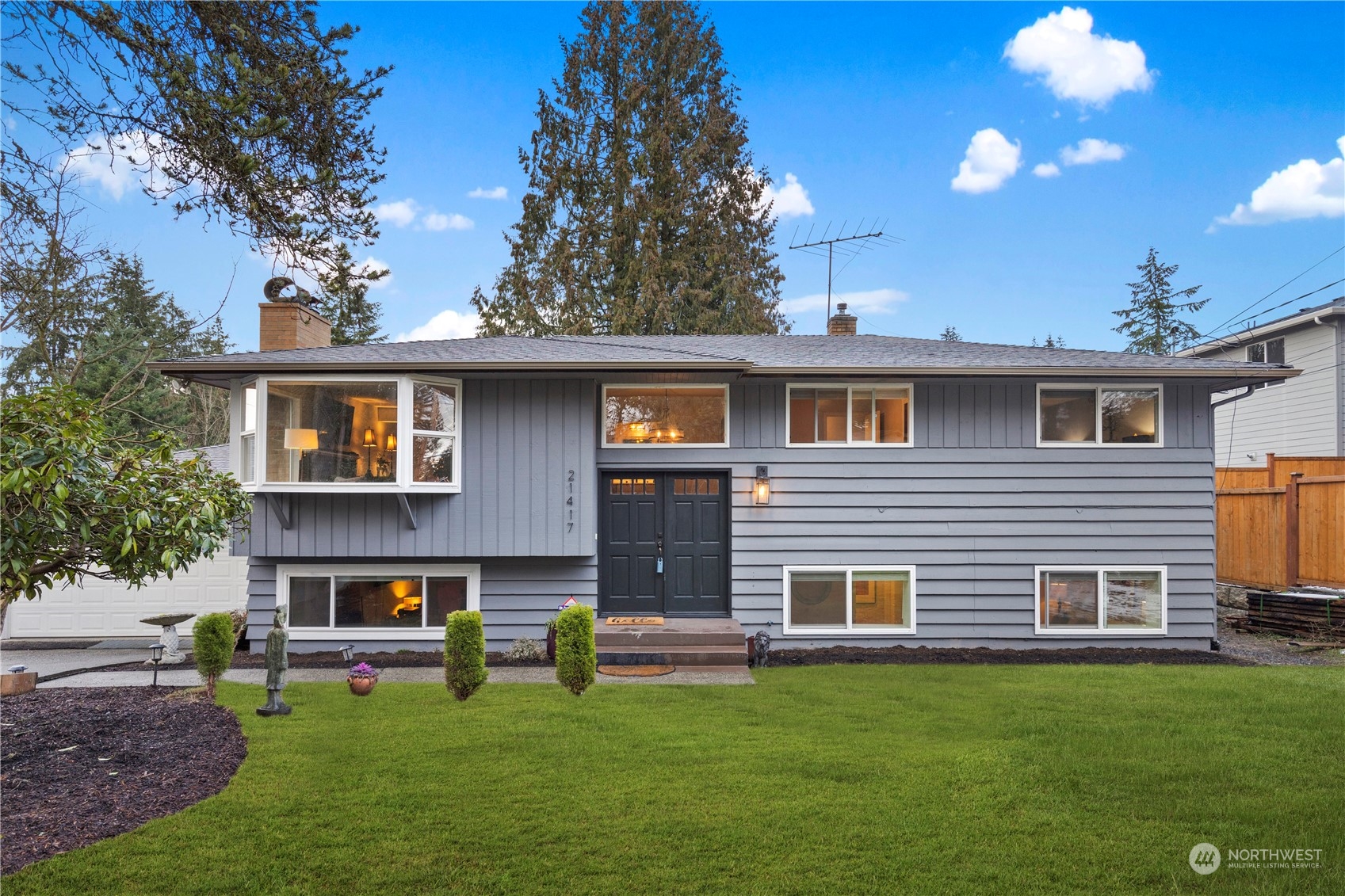 21417 Meridian Drive Southeast Bothell, WA 98021 - Photo 1 of 36 a front view of house with yard