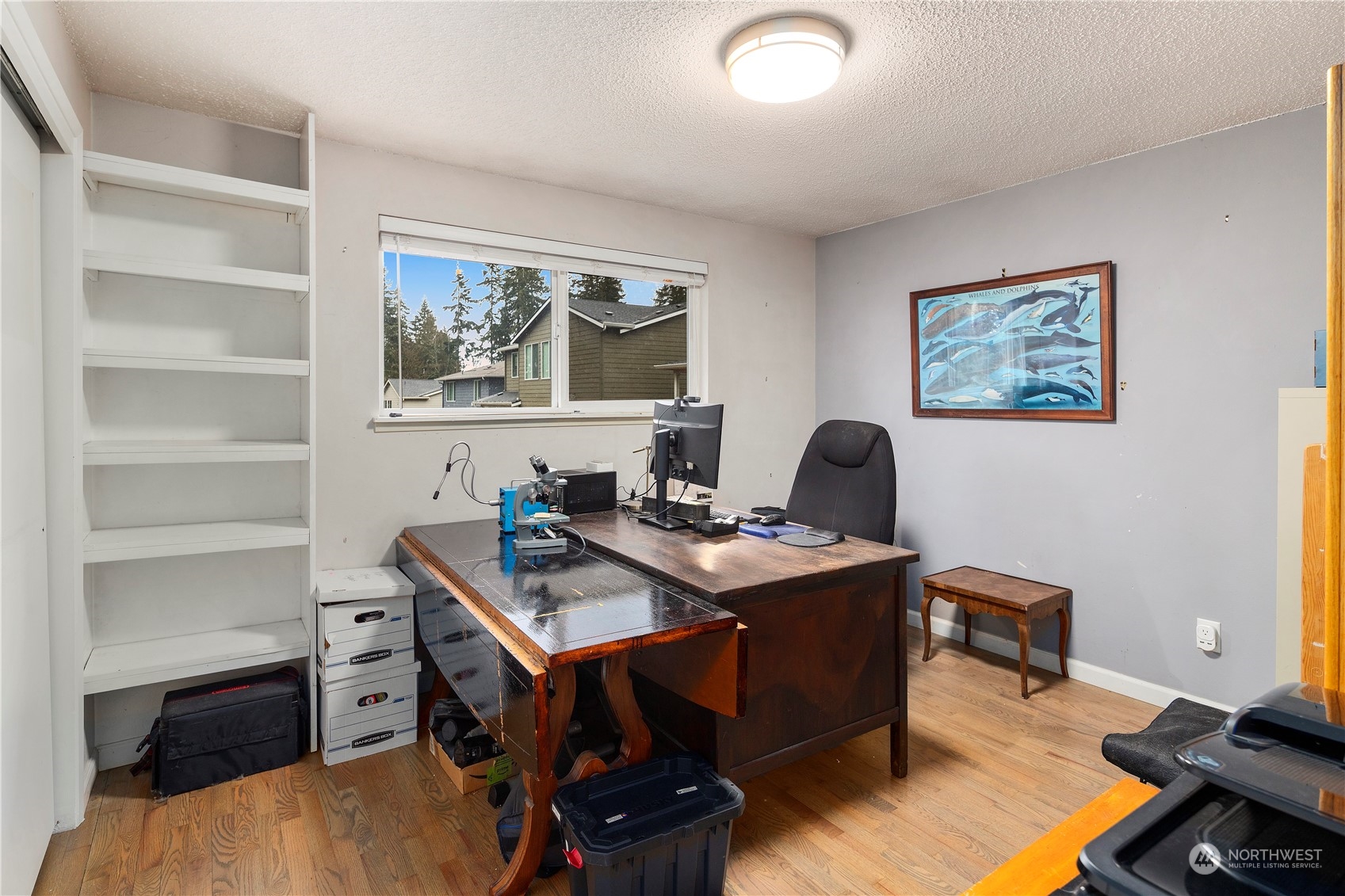 21417 Meridian Drive Southeast Bothell, WA 98021 - Photo 19 of 36 a view of a workspace with furniture and a window
