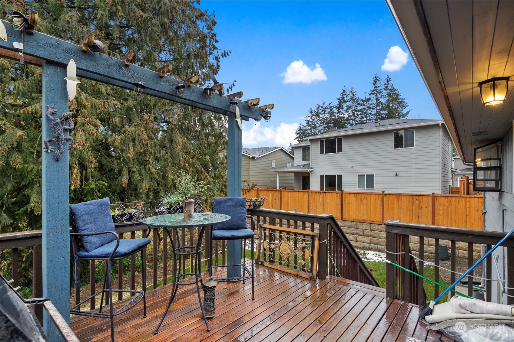 21417 Meridian Drive Southeast Bothell, WA 98021 - Photo 34 of 36 a view of balcony with wooden floor and outdoor seating