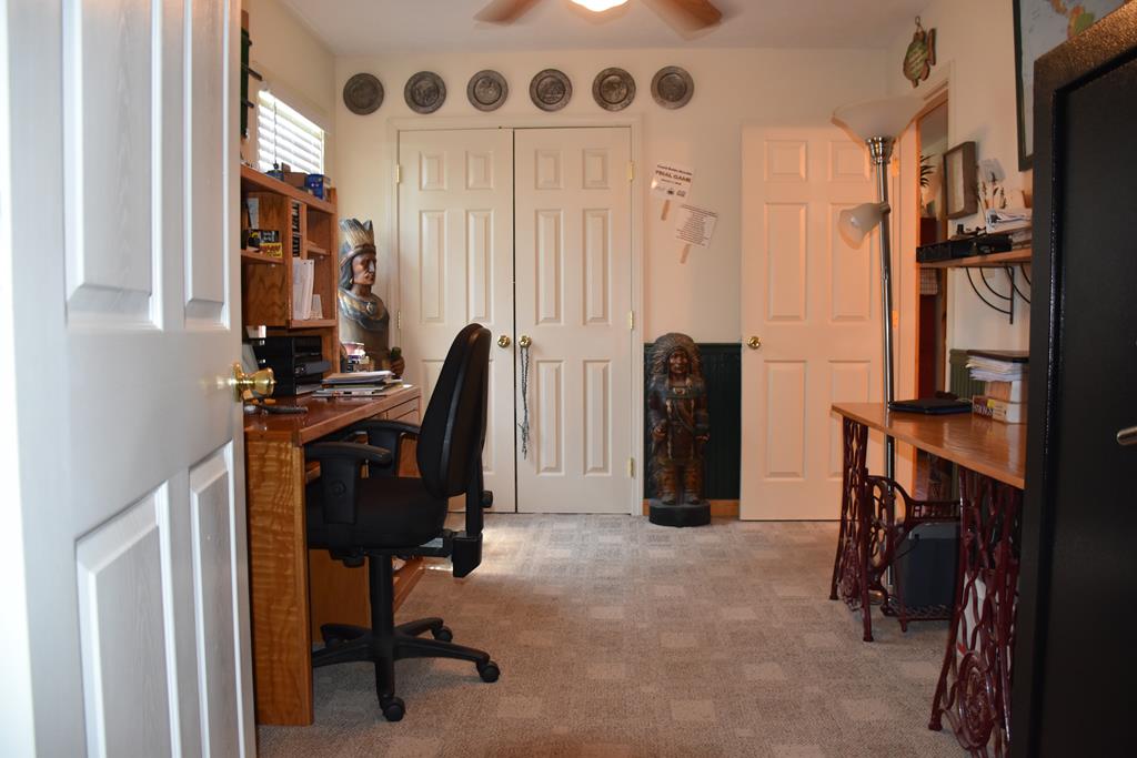 297 Liberty Road Mauk, GA 31058 - Photo 14 of 17 a view of a workspace with furniture and a window