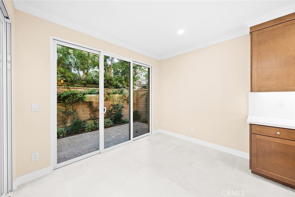 143 Rodeo Irvine, CA 92602 - Photo 9 of 37 a view of an empty room with wooden floor and a window