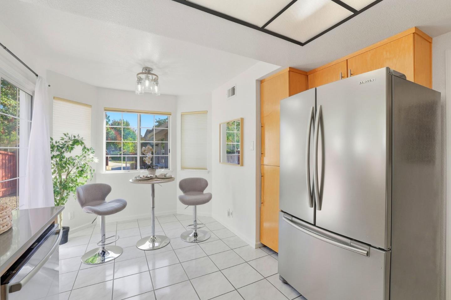 2327 Farmcrest Street Milpitas, CA 95035 - Photo 11 of 36 a kitchen with stainless steel appliances granite countertop a refrigerator and a glass door