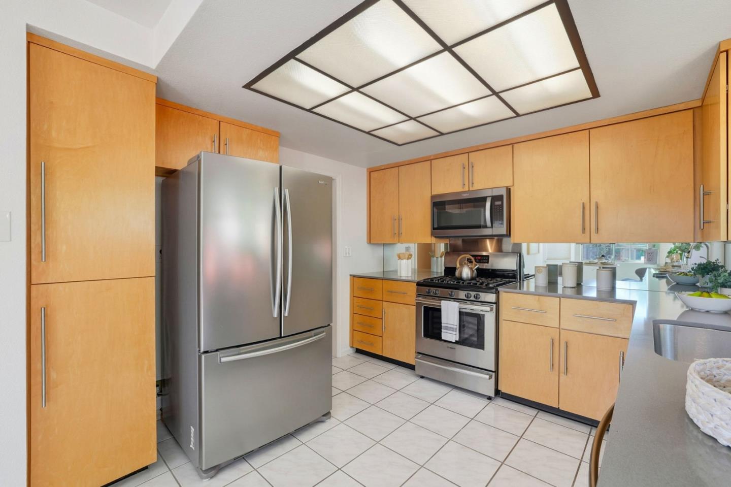 2327 Farmcrest Street Milpitas, CA 95035 - Photo 12 of 36 a kitchen with stainless steel appliances granite countertop a refrigerator a stove top oven a sink and dishwasher