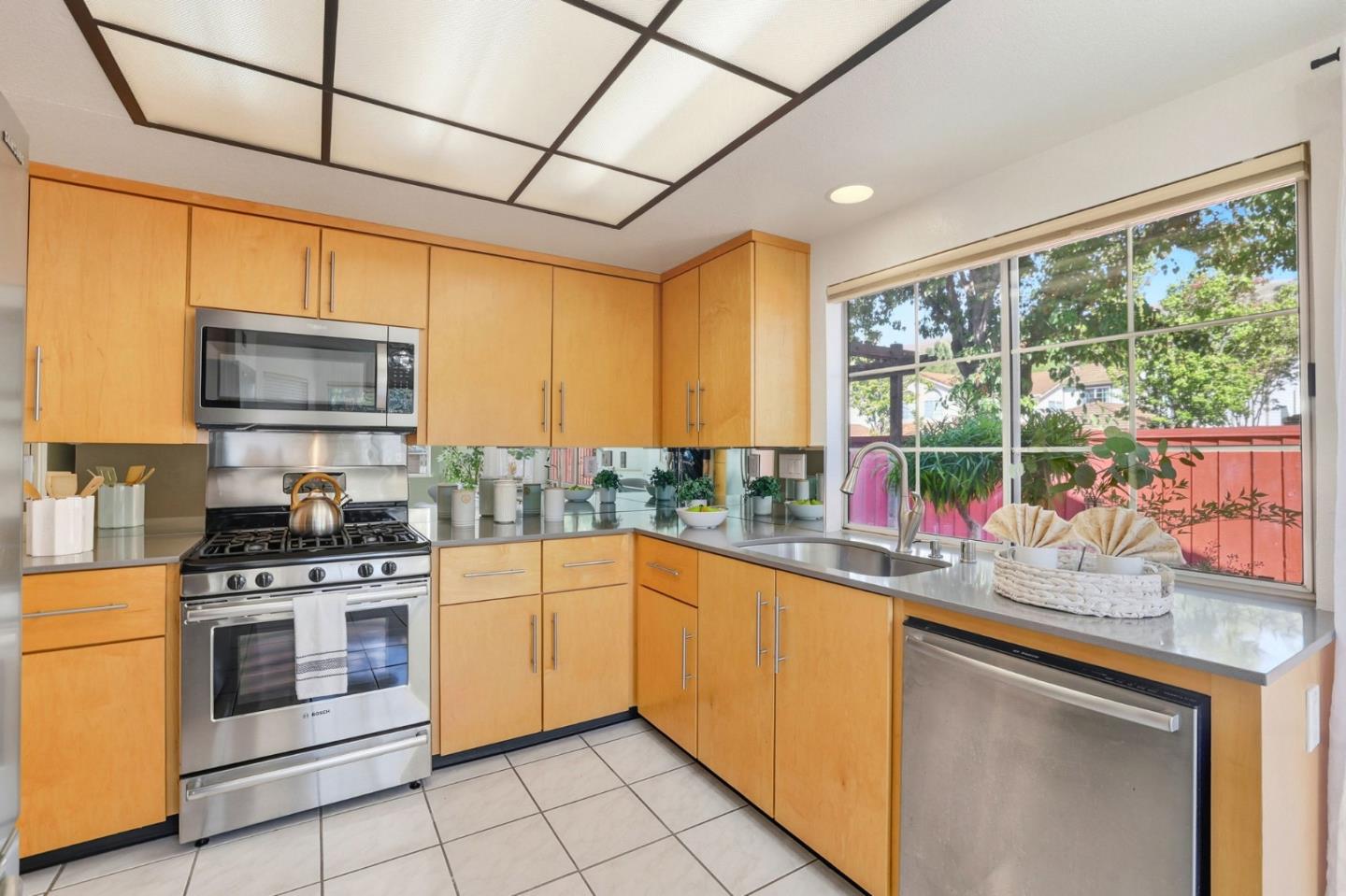 2327 Farmcrest Street Milpitas, CA 95035 - Photo 13 of 36 a kitchen with stainless steel appliances a stove sink and microwave
