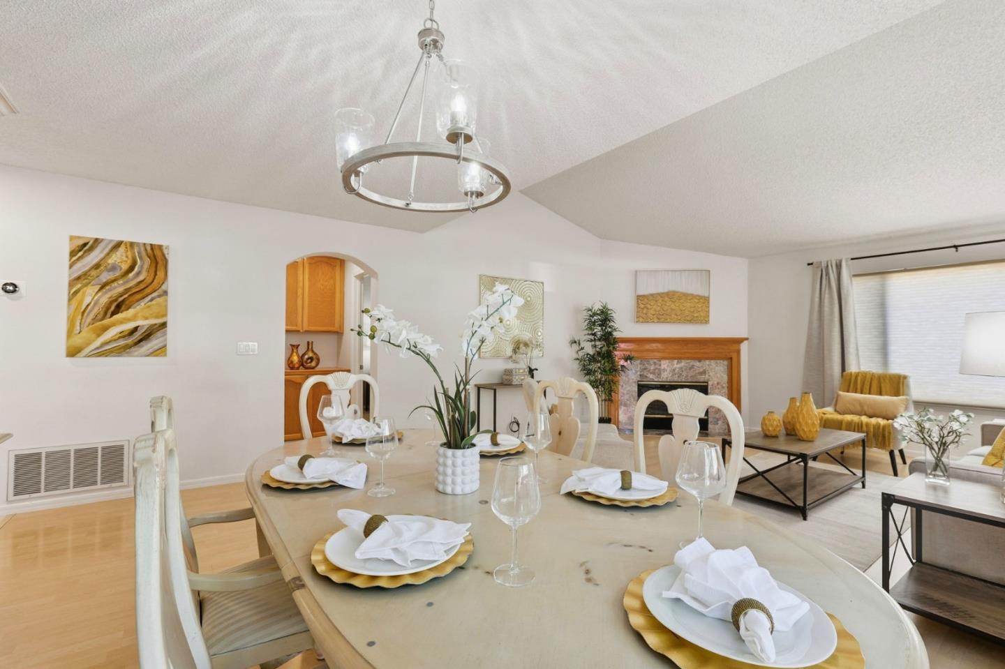 2327 Farmcrest Street Milpitas, CA 95035 - Photo 16 of 36 a dining room with furniture a kitchen view and wooden floor